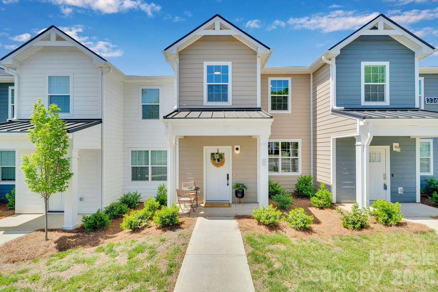 Front exterior of a new home in , Concord, NC, highlighting curb appeal (Image 23).
