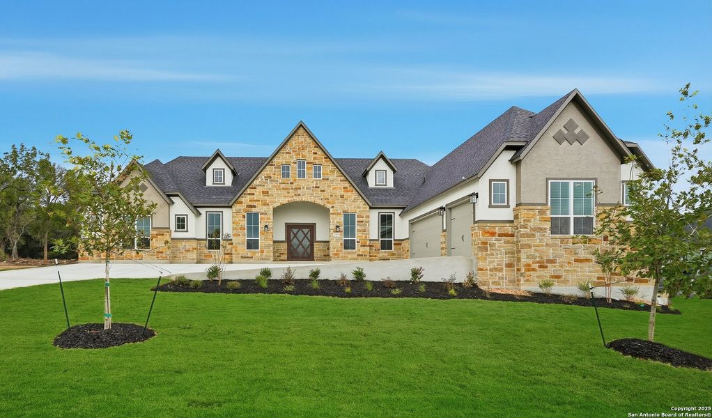 Front exterior of a new home in Caliza Reserve, Boerne, TX, highlighting curb appeal (Image 1). Front exterior of a new home in Caliza Reserve, Boerne, TX, highlighting curb appeal (Image 1).