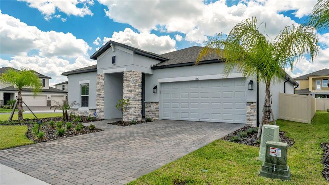 Front exterior of a new home in , Lakeland, FL, highlighting curb appeal (Image 26).