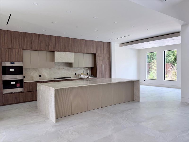 Kitchen with island for 6 seaters and taj mahal quartzite/breakfast room