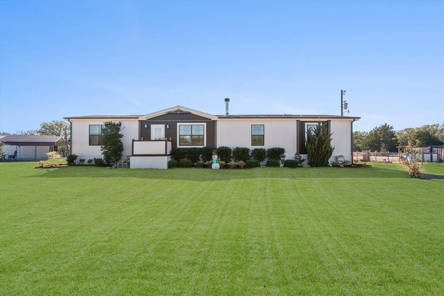 Home with a front yard Home with a front yard