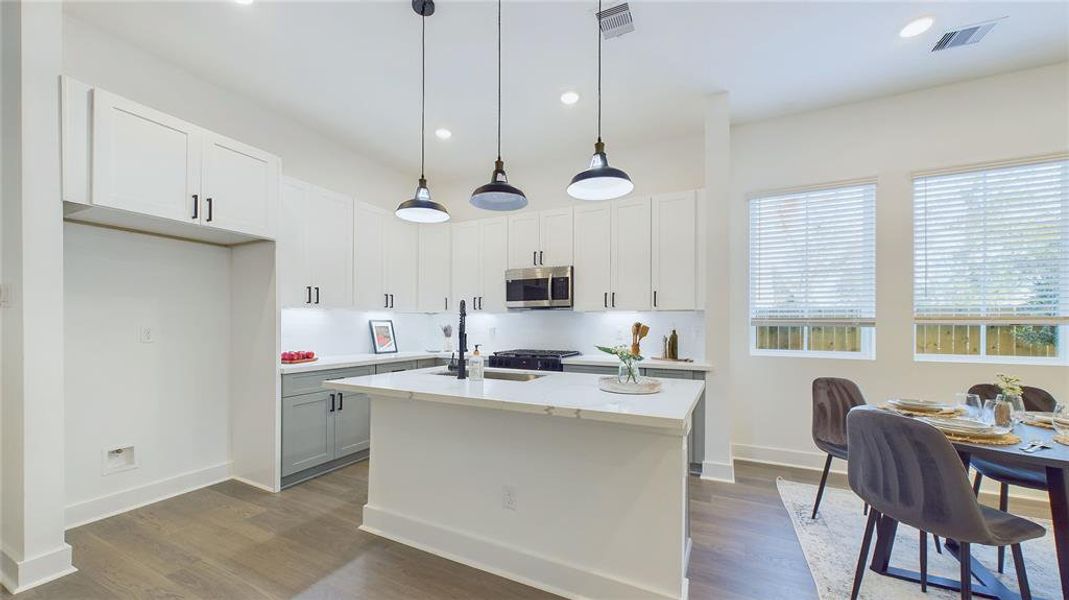 Step inside to an inviting open-concept layout, where the kitchen seamlessly flows into the spacious living room—perfect for entertaining and daily living