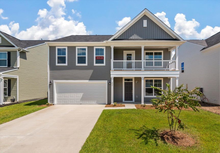 Front exterior of a new home in Oakley Pointe, Moncks Corner, SC, highlighting curb appeal (Image 20).