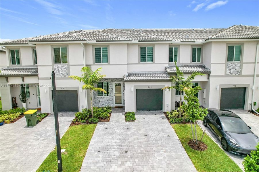 Front exterior of a new home in , Homestead, FL, highlighting curb appeal (Image 22). Front exterior of a new home in , Homestead, FL, highlighting curb appeal (Image 22).
