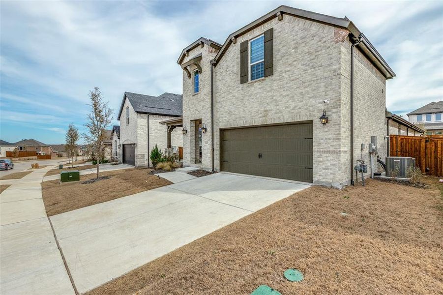 Front exterior of a new home in Lilyana - 50s, Celina, TX, highlighting curb appeal (Image 24).