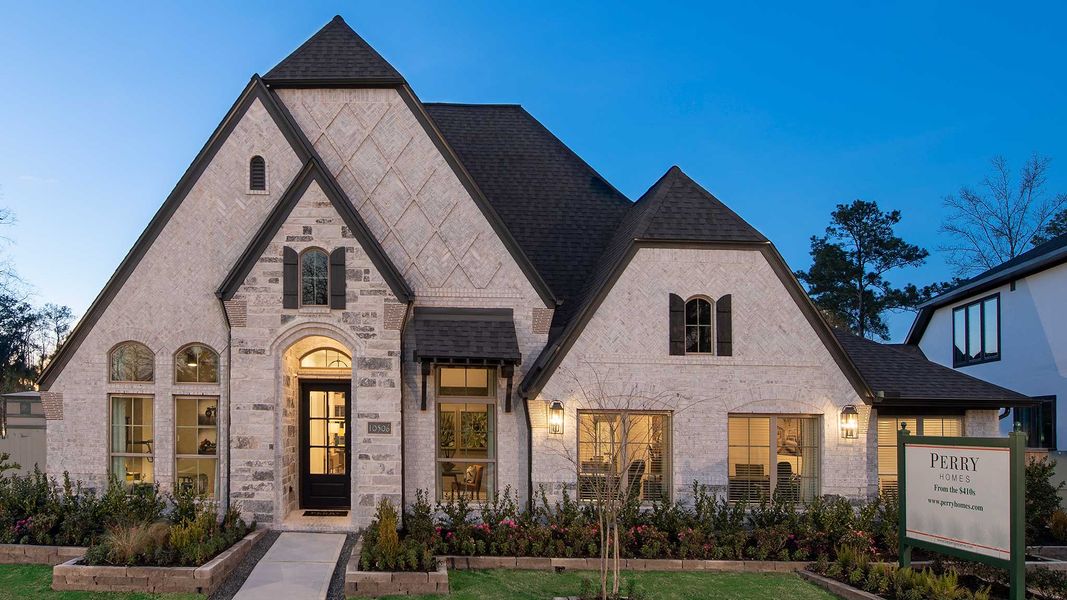 Front exterior of a new home in Trinity Falls, McKinney, TX, highlighting curb appeal (Image 24).
