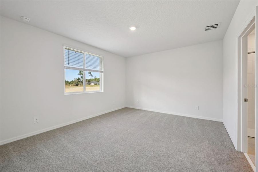 Spacious, unfurnished interior of a new home in Ridgehaven - Villas, Ormond Beach (Image 26).