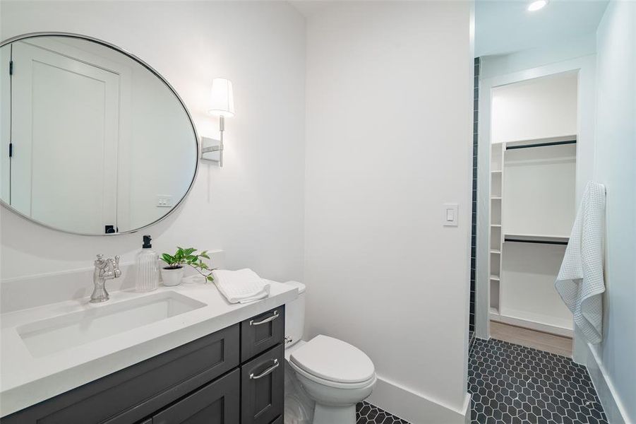 Bathroom with vanity and toilet