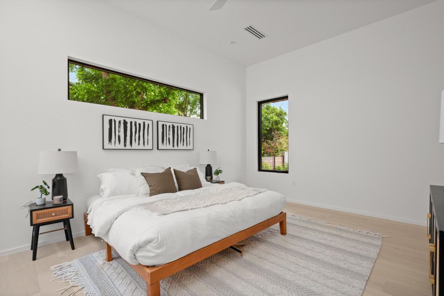 Bedroom featuring a ceiling fan and light wood-style flooring