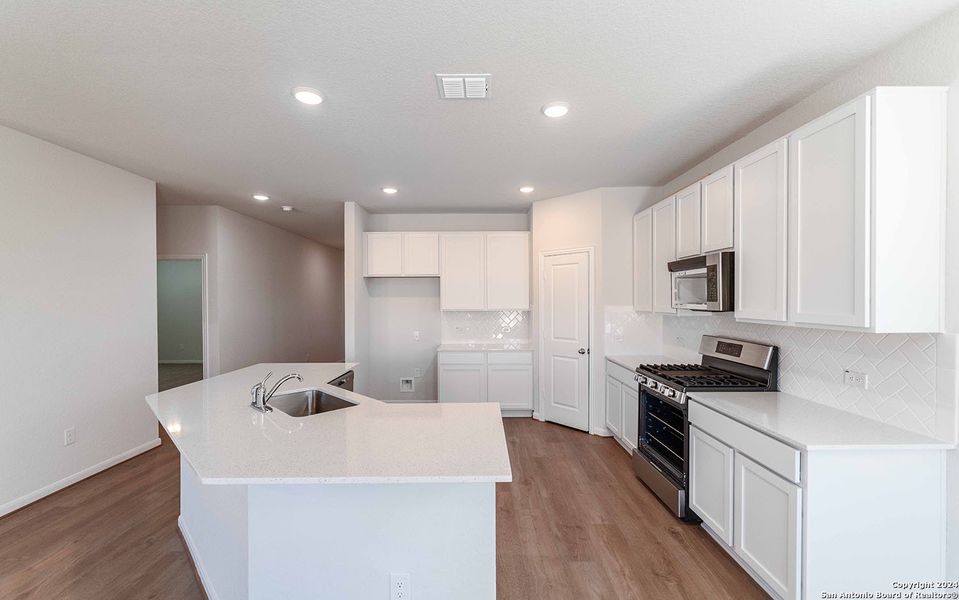 Furnished interior view inside a new home in Hennersby Hollow, San Antonio (Image 8).