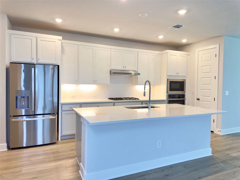 Furnished interior view inside a new home in The Colony 50', Bastrop (Image 11).