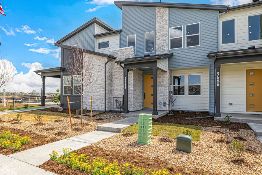 Front exterior of a new home in Painted Prairie, Aurora, CO, highlighting curb appeal (Image 26).