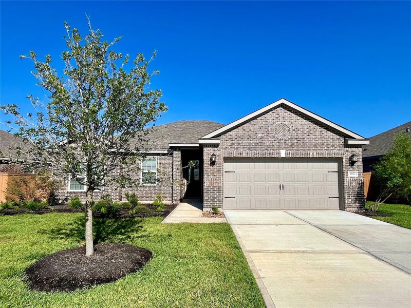 Front exterior of a new home in Sierra Vista, Iowa Colony, TX, highlighting curb appeal (Image 1). Front exterior of a new home in Sierra Vista, Iowa Colony, TX, highlighting curb appeal (Image 1).