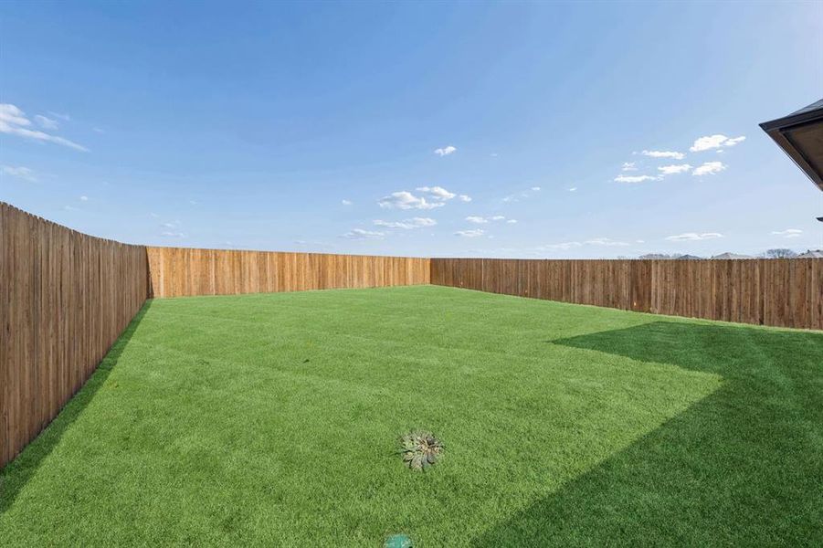 Covered Patio in the Oak II home plan by Trophy Signature Homes – REPRESENTATIVE PHOTO
