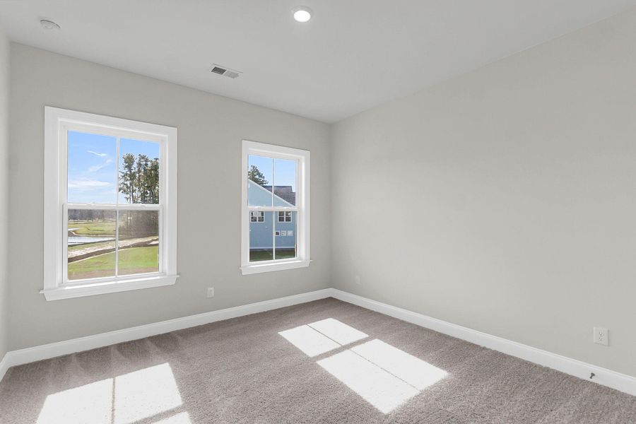 Spacious, unfurnished interior of a new home in Tidewater at Lakes of Cane Bay, Summerville (Image 22).