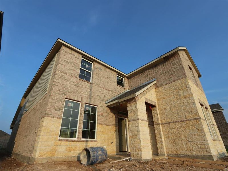Front exterior of a new home in Marvida, Cypress, TX, highlighting curb appeal (Image 1).