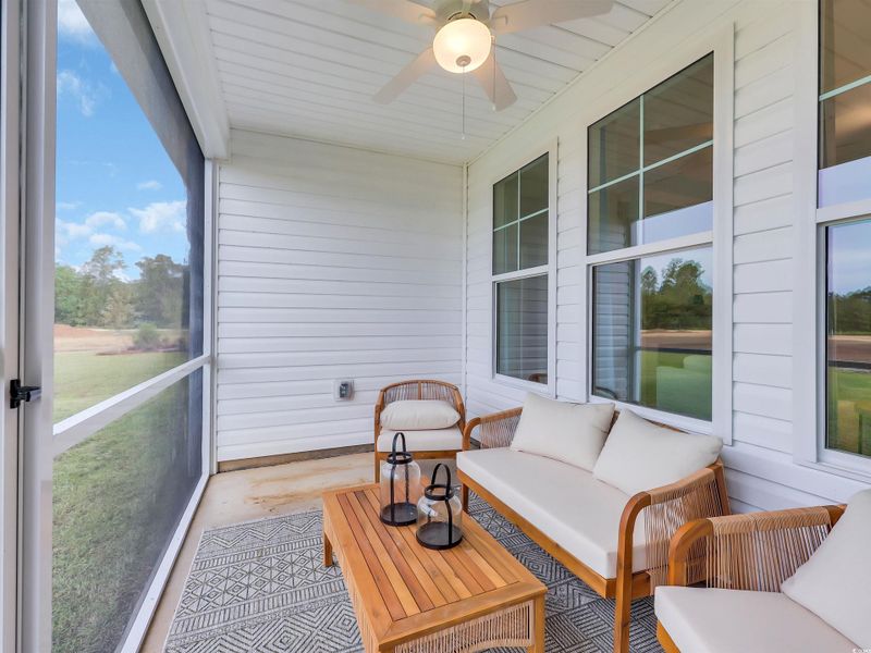 Sunroom / solarium featuring a ceiling fan, plenty of natural light, and an outdoor hangout area Sunroom / solarium featuring a ceiling fan, plenty of natural light, and an outdoor hangout area