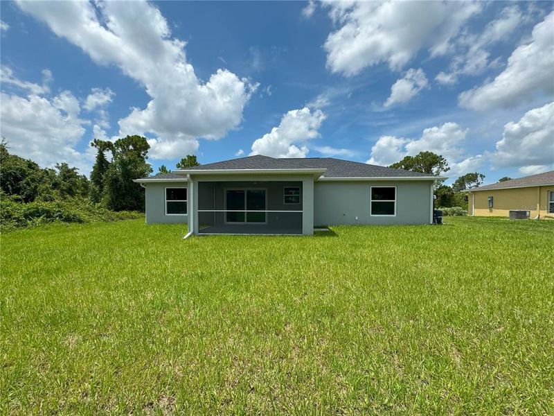 Front exterior of a new home in , North Port, FL, highlighting curb appeal (Image 2). Front exterior of a new home in , North Port, FL, highlighting curb appeal (Image 2).
