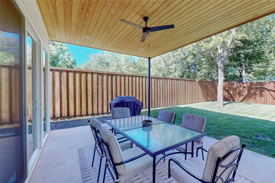 View of patio featuring ceiling fan