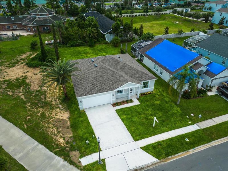Front exterior of a new home in , Kissimmee, FL, highlighting curb appeal (Image 1).