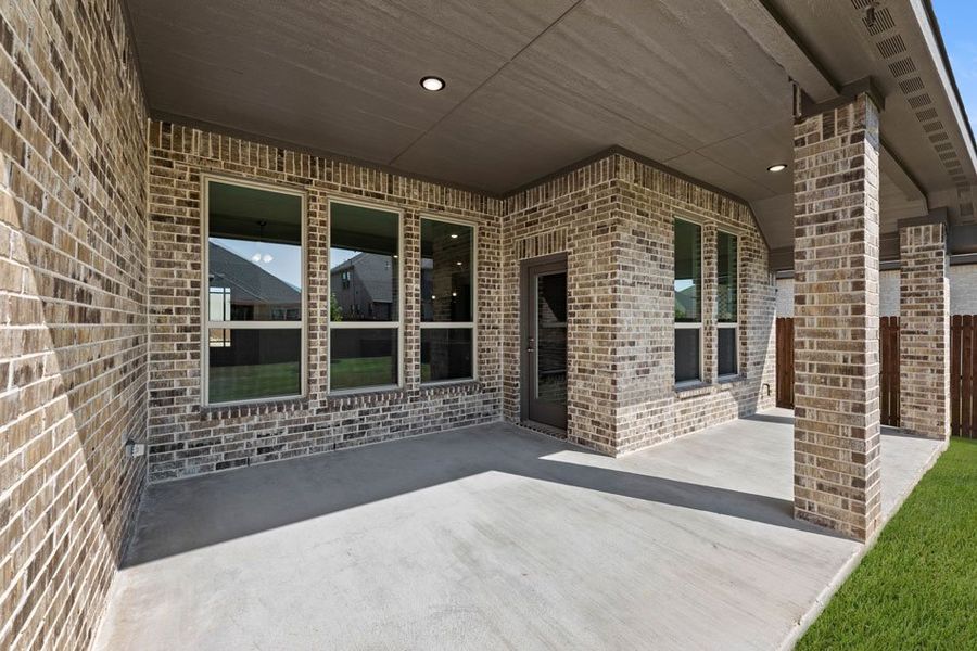Representative exterior photo of a completed home built from the Cromwell by Impression Homes in Still Water Lake, Godley, TX (Image 22).