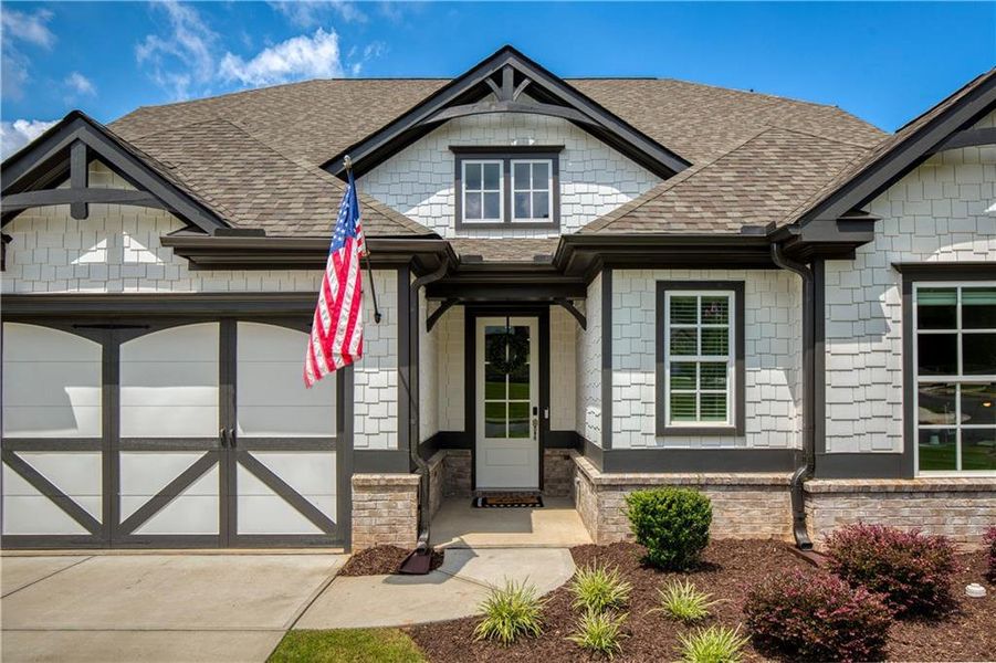 Front exterior of a new home in Yellowstone Farms, Cumming, GA, highlighting curb appeal (Image 24). Front exterior of a new home in Yellowstone Farms, Cumming, GA, highlighting curb appeal (Image 24).