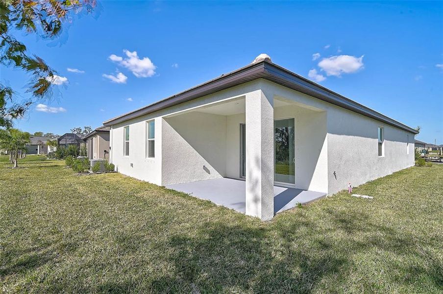 Exterior details and patio area of a home in Prosperity Lakes Active Adult: Active Adult Manors, Parrish (Image 4).