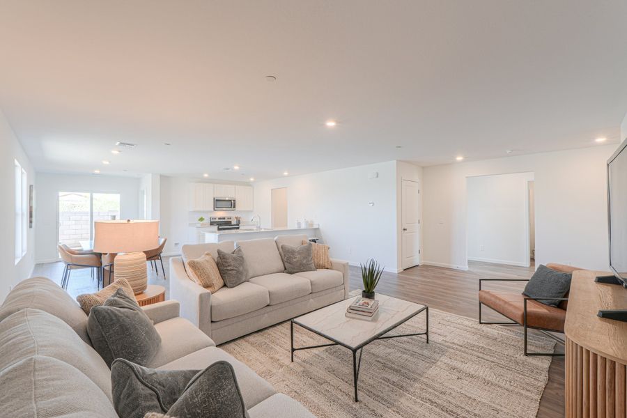 A living room with a couch and a coffee table. A living room with a couch and a coffee table.