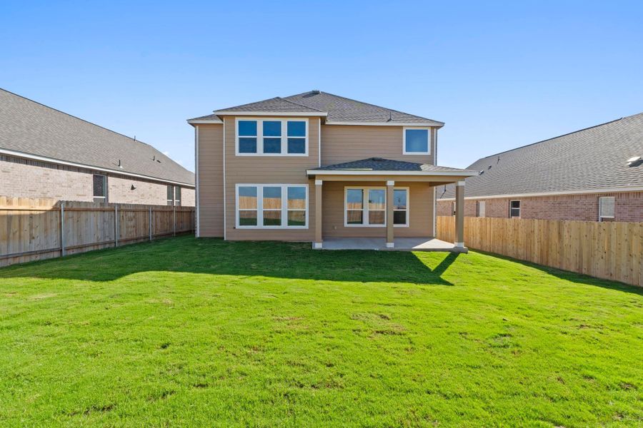 Front exterior of a new home in Salerno - Classic Collection, Round Rock, TX, highlighting curb appeal (Image 20). Front exterior of a new home in Salerno - Classic Collection, Round Rock, TX, highlighting curb appeal (Image 20).