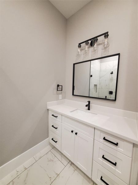 GUEST SUITE BATHROOM WITH CUSTOM MIRRIOR AND BATHROOM HARDWARE INCLUDED GUEST SUITE BATHROOM WITH CUSTOM MIRRIOR AND BATHROOM HARDWARE INCLUDED