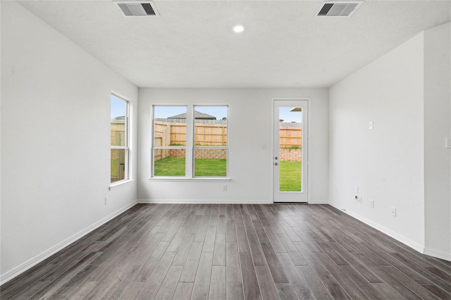 Bring family and friends together in this beautiful Great Room! It features soaring ceilings, recessed lighting, custom paint, tile flooring, and large windows that fill the space with natural light all day long. Bring family and friends together in this beautiful Great Room! It features soaring ceilings, recessed lighting, custom paint, tile flooring, and large windows that fill the space with natural light all day long.