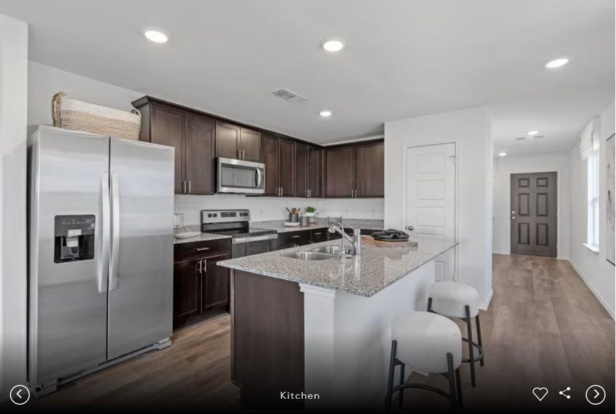 Interior photos- Photo of Pulte model home with same floor plan, not of actual home listed.