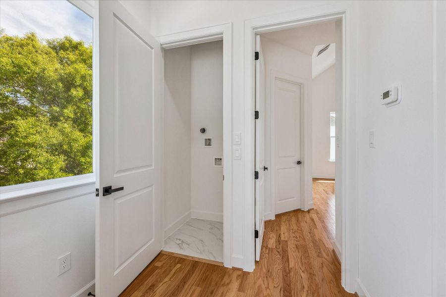 Conveniently situated on the third floor, the laundry room rests just off the landing, offering easy access while maintaining a discreet and functional location within the home. Conveniently situated on the third floor, the laundry room rests just off the landing, offering easy access while maintaining a discreet and functional location within the home.