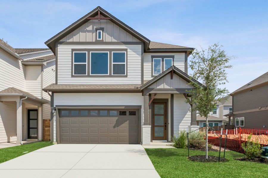 Front exterior of a new home in Double Creek Crossing – Craftsman Series, Round Rock, TX, highlighting curb appeal (Image 1). Front exterior of a new home in Double Creek Crossing – Craftsman Series, Round Rock, TX, highlighting curb appeal (Image 1).