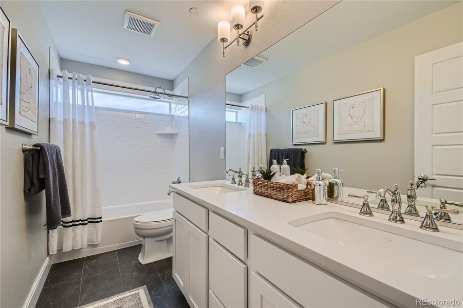 Guest Bathroom with Double Sinks and Quart Countertops!-Photo of Model