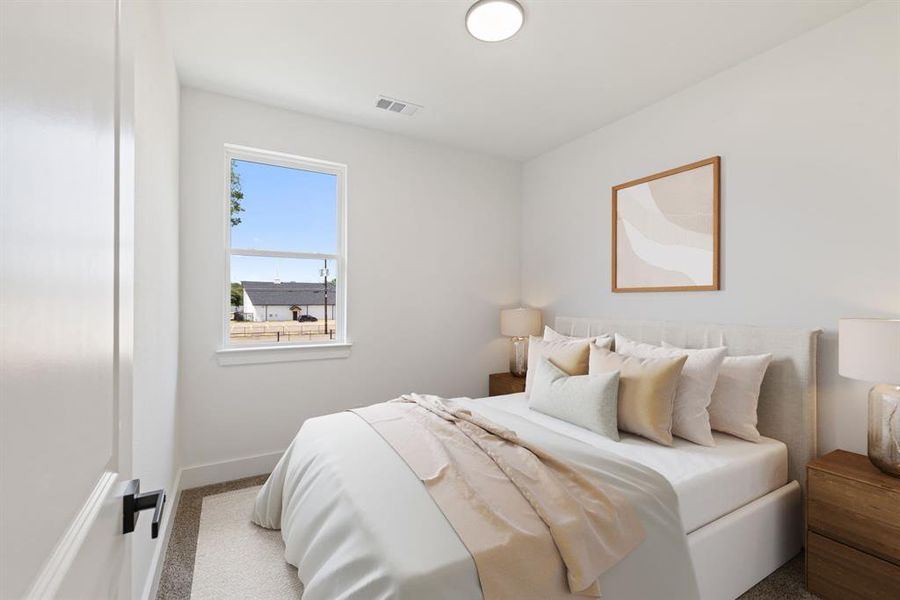 Bedroom with carpet and baseboards
