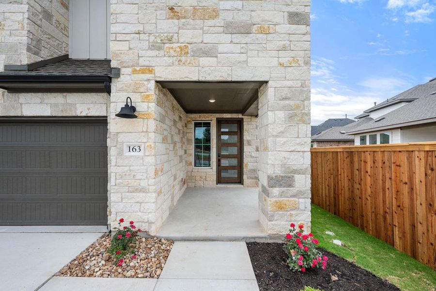 Exterior details and patio area of a home in Heritage, Dripping Springs (Image 24).