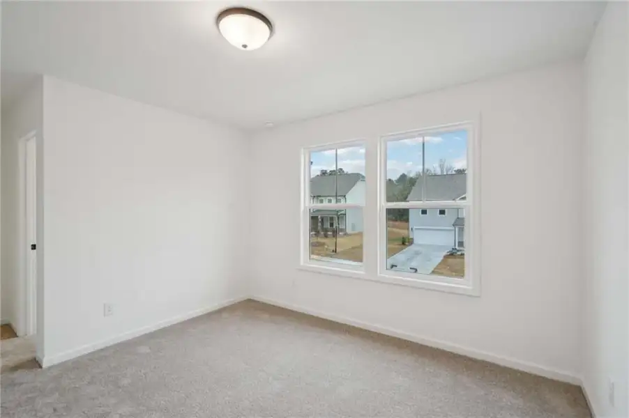 Spacious, unfurnished interior of a new home in Eastlyn Crossing, Flowery Branch (Image 14).