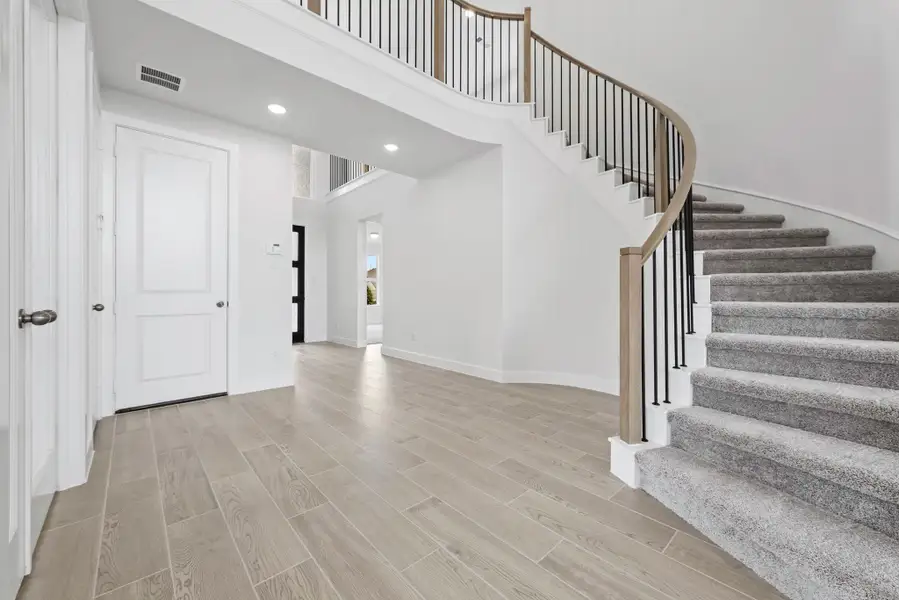 Spacious, unfurnished interior of a new home in Bridgeland, Cypress (Image 9). Spacious, unfurnished interior of a new home in Bridgeland, Cypress (Image 9).