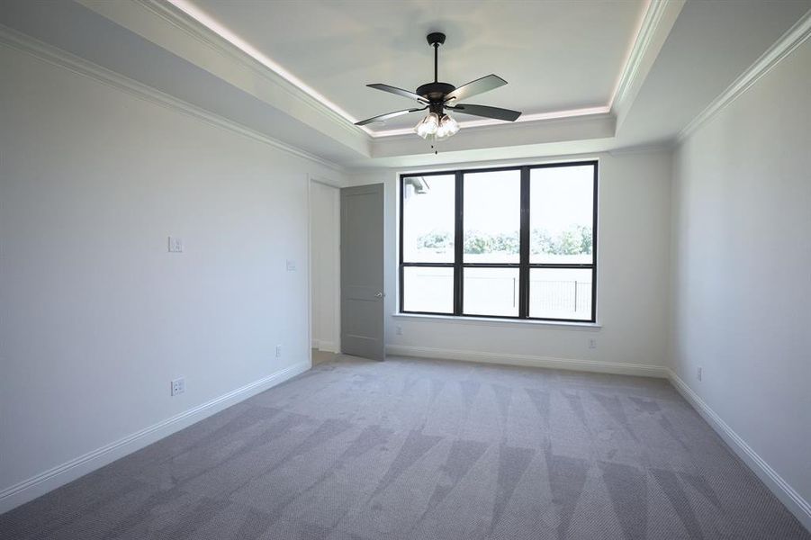 Master Bedroom with view of the back yard and golf course