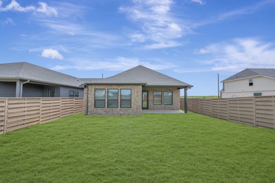 Exterior details and patio area of a home in Austin Point - Terrace Collection, Richmond (Image 3).