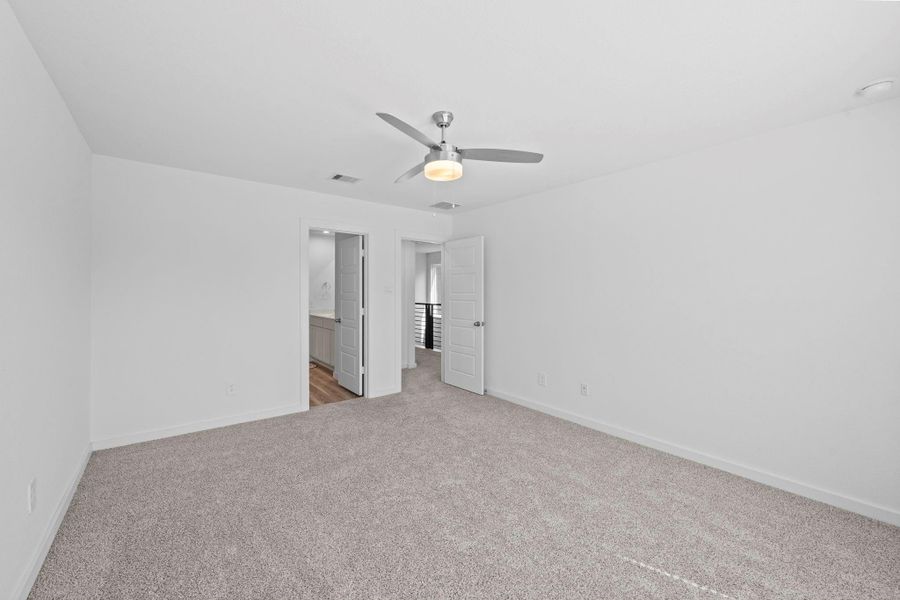 Primary bedroom with ensuite bathroom and walk in closet Primary bedroom with ensuite bathroom and walk in closet