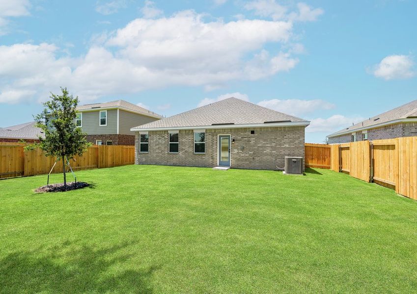 The back yard of the Reed has a large fenced-in back yard.