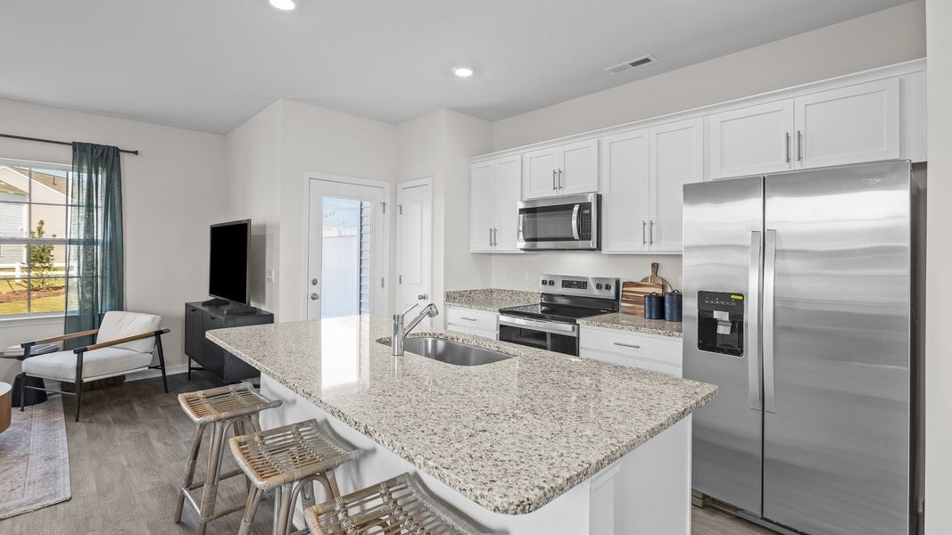 Furnished interior view inside a new home in The Townes at Ridgewood Farms, Winterville (Image 6).