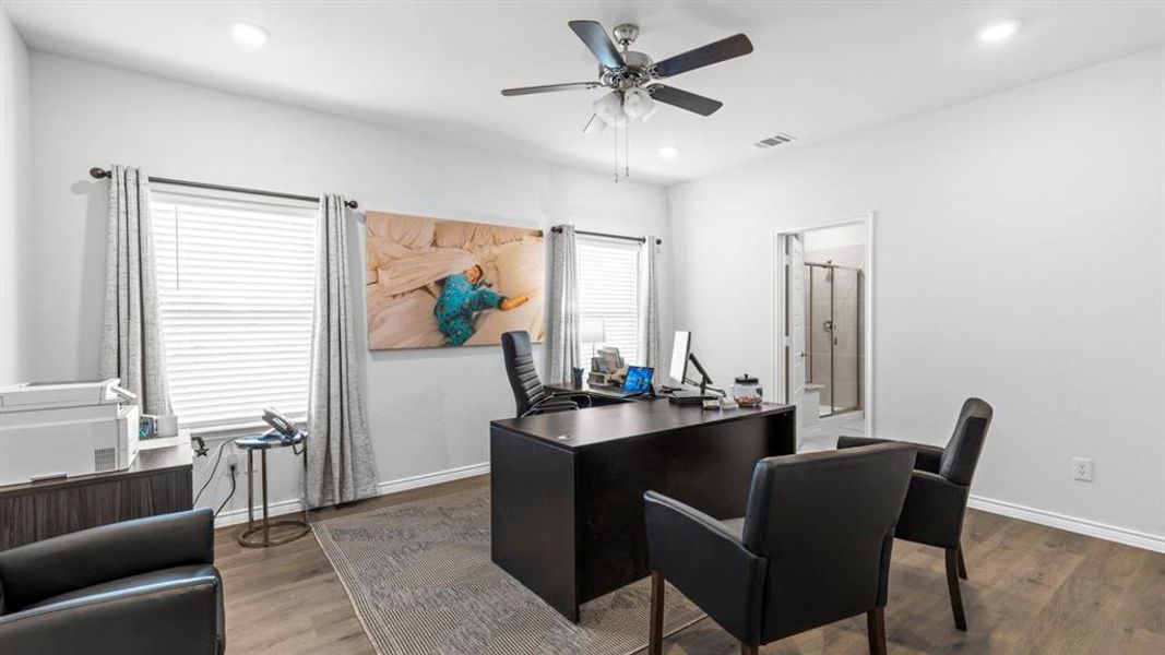 Bright office space featuring wood-finish flooring, recessed lighting, and a ceiling fan Bright office space featuring wood-finish flooring, recessed lighting, and a ceiling fan
