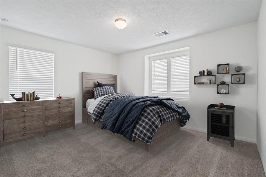 Secondary bedroom features plush carpet, neutral paint, lighting, large windows with privacy blinds and ample sized closet space.