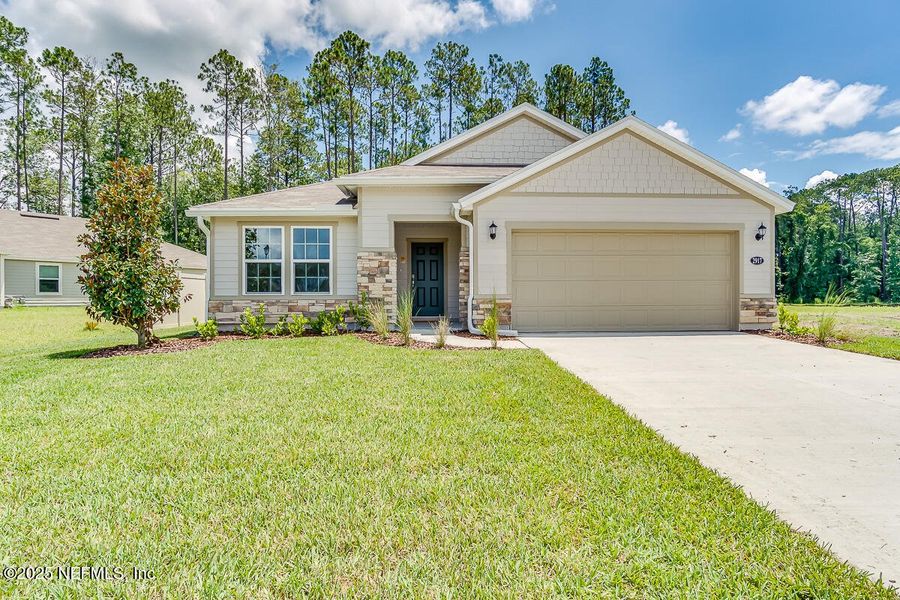 Front exterior of a new home in Anabelle Island - Classic Series, Green Cove Springs, FL, highlighting curb appeal (Image 2).