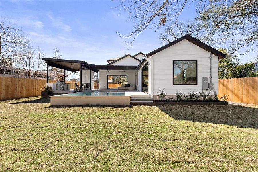 Rear view of home, pool and outdoor living 2