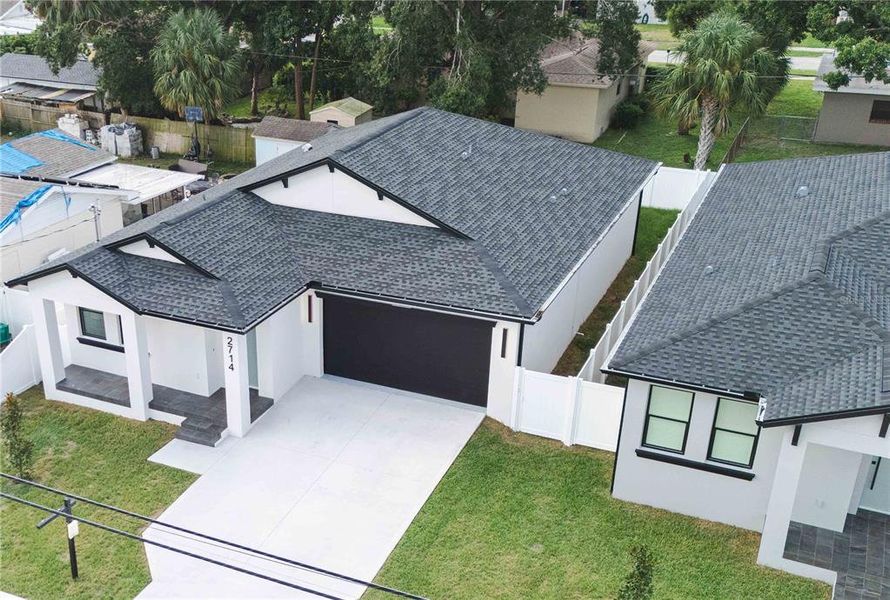 Front exterior of a new home in , Tampa, FL, highlighting curb appeal (Image 1). Front exterior of a new home in , Tampa, FL, highlighting curb appeal (Image 1).