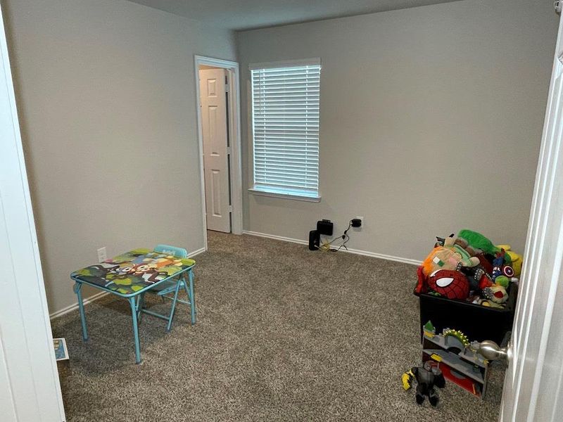 Rec room featuring carpet and baseboards